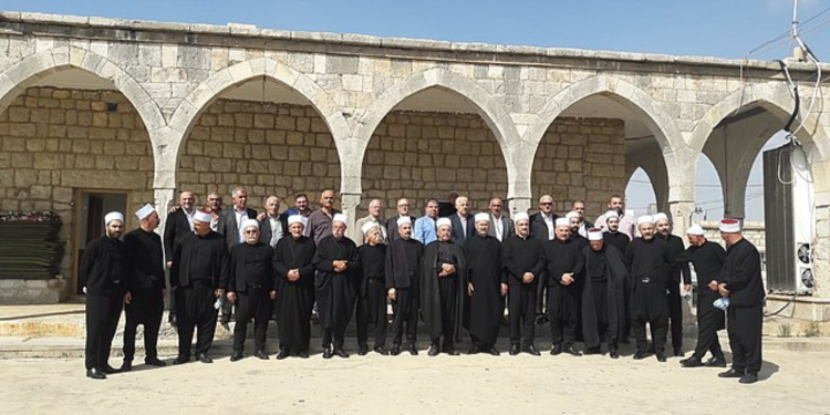 Druze community members standing outside the Khalwat prayer house