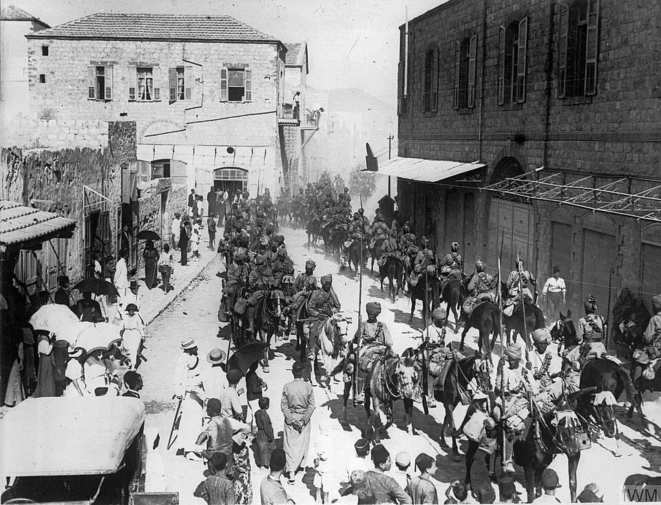 Jodhpur lancers marching through Haifa after it was captured.